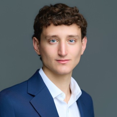 Zachary Epstein in a blue blazer and white shirt